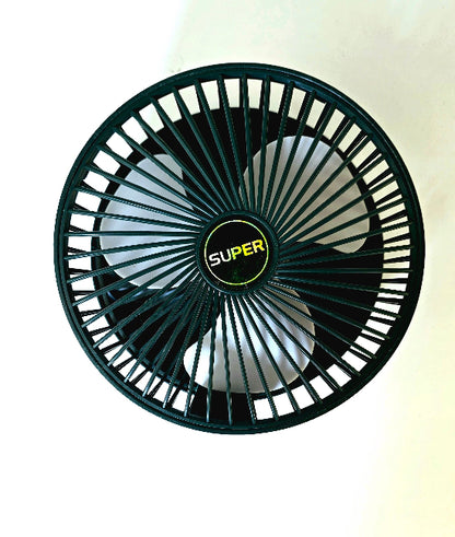 Super Mini Fan operating on desk beside laptop for personal cooling